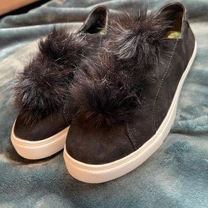 Black pom-pom Steve Madden slip on sneakers